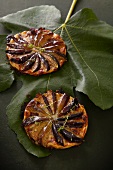 Individual fig tarts on a leaf