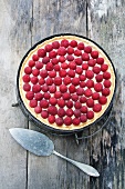 Raspberry tart on a wooden surface