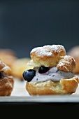 A profiterole filled with quark and blueberries