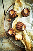 Caneles and Cheese Cloth on a Platter