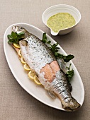 Poached sea trout with lemons and a herb sauce