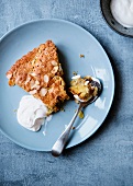 Apple pie with almond flakes and creme fraiche