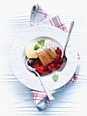 Berry pudding with vanilla ice cream