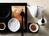 A still life featuring Asian tea paraphernalia