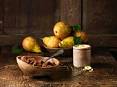 Pears and spiced muscovado sugar and molasses on rustic wooden surface