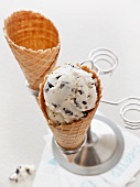 An ice cream cone filled with almond and stracciatella ice cream
