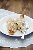 Mini Topfenstrudel (Strudel with a soft quark cheese) with apples and raisins