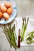Fresh eggs and green asparagus