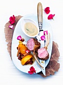 Rack of lamb with aromatic cardamom & espresso caramel sauce and peaches