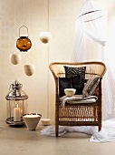 African touch with rattan chair, pillows, hanging bowls and decorative candles