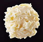 A white chocolate truffle (close-up)