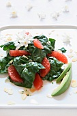 Spinach salad with grapefruit, avocado and sliced almonds