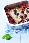 Baked mackerel with cherry tomatoes and olives
