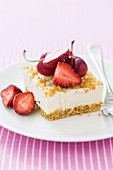 Cheesecake slice with strawberries and cherries