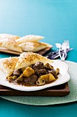 Beef pie with peppers and mushrooms
