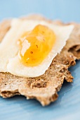Rye crispbread from Sweden with parmesan and apricot jam