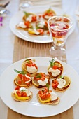 Mini pancakes with lemon slices, sour cream, smoked salmon and fennel tops