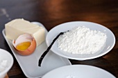 A vanilla pod, flour, an egg yolk and butter