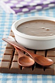 Chocolate sauce and wooden spoons