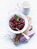 Red berry compote with mint leaves