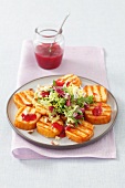 Barbecued sheep's cheese with salad and cranberry jam
