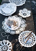 Dishes made from lace doilies on stone step