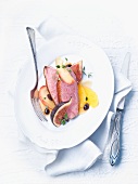 Duck breast with fruit and an orange sauce