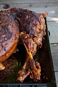 Roasted leg of lamb in a roasting tin