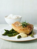Veal cutlet with taleggio, asparagus and a side dish of rice