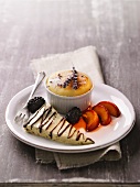 Goat cheese souffle with lavender flowers, fruit and goat cheese cheesecake