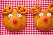 Two decorative gingerbread cookies look like a reindeers