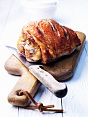Roast turkey thigh on a cutting board
