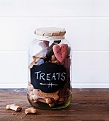 Dog biscuits in screw-top jar with chalk label