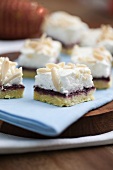 Cake with boysenberry jelly, meringue and sliced almonds