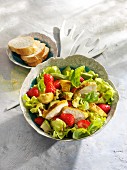 Lettuce with avocado, chicken breast and strawberries