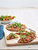 Pizza with ham and rocket