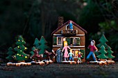 A Christmas scene with a gingerbread house