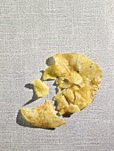 A crushed potato chip (view from above)