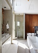 Spacious bathroom with twin washbasins, bathtub & separate, glazed shower area