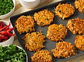 Sweet potato curry fritters on a baking tray