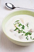 Cream of asparagus soup with meatballs