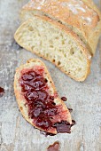 Freshly sliced white bread with strawberry jam