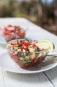 Aubergine and pepper salad garnished with limes