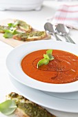 Tomato soup with olive oil and basil