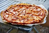 Apple tart on grease-proof paper