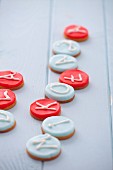 Round marzipan biscuits decorated with letters