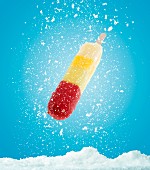 A fruit ice lolly with snow