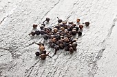 Cubeb (tailed pepper) on grey wood