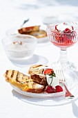 Grilled slices of Hefezopf (sweet bread from southern Germany) with strawberries and mint