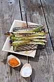 Grilled spring onions with pepper salsa